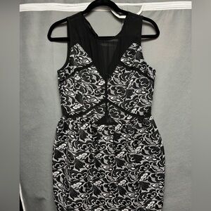 Never worn - original tags; Black and white floral print dress with zip-up back
